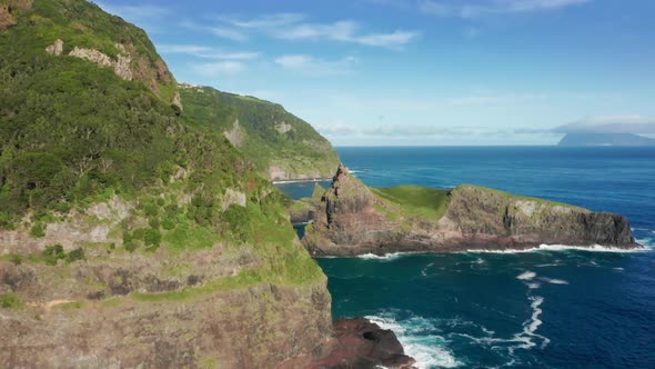Incredible Vista of Rocky Formations Washed By Foamy Sea Waves alt