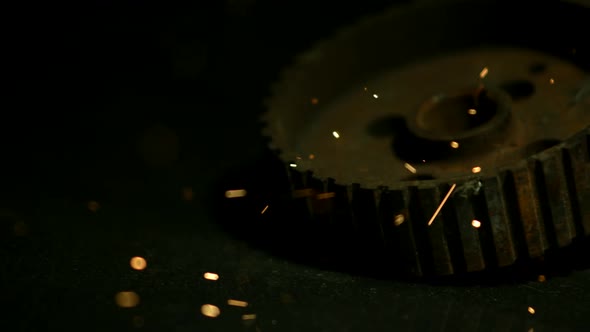 Sparks with gears in ultra slow motion 1500fps on a reflective surface - SPARKS w GEARS  alt