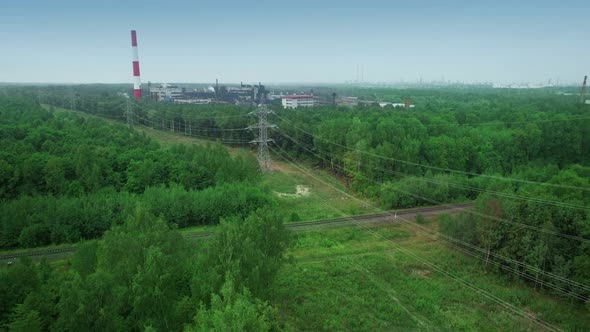Highvoltage Power Transmission Lines Tower on a Dirty Coalfired Carbon Dioxideemitting Factory