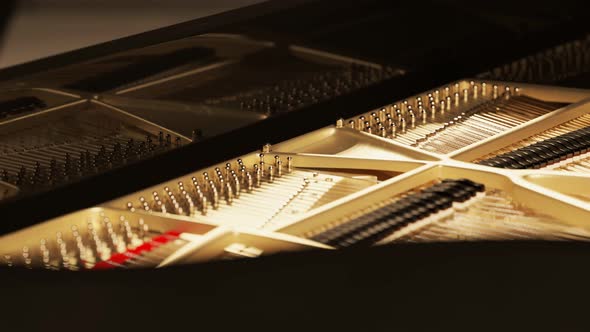 Wooden interior of a grand piano. Close up shot of a classic instrument. 4K HD alt