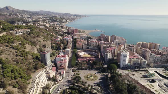 Aerial view Malaga coastline, through Bullring and Mount Gibralfaro viewpoint, Costa del sol