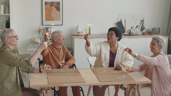 Senior Friends Holding Bengal Lights alt