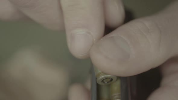Cartridges Charge. Close-up. Slow Motion alt