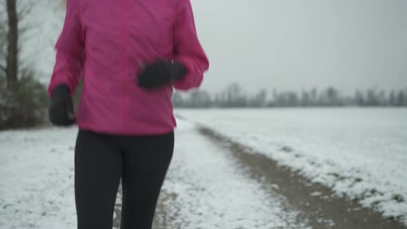 Body of Running Woman in Winter