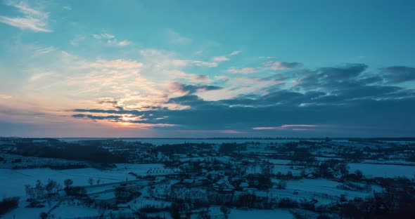Spectacular and Very Colorful Winter Sunset in the Village  Aerial Flight