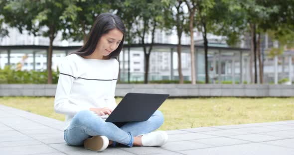 Woman using on laptop computer alt