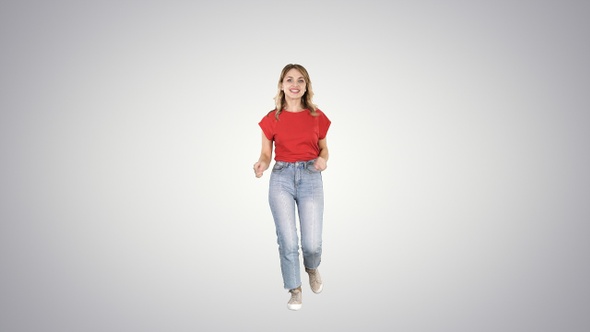 Happy funny woman running on gradient background. alt