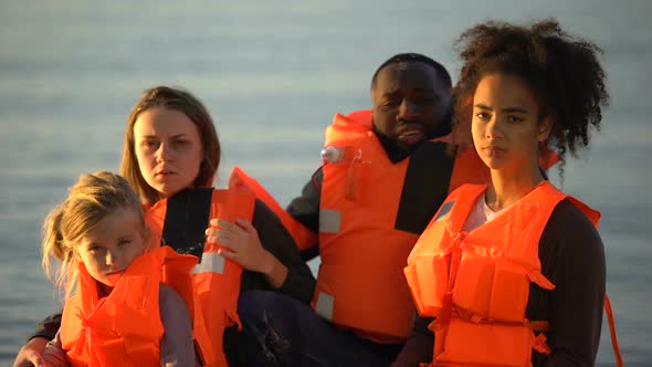Portrait of Refugee Family Saved During Shipwreck at Illegal Border Crossing alt