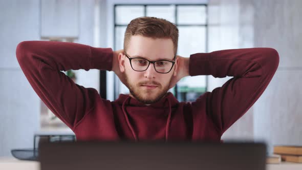 Man at Office Working on Laptop