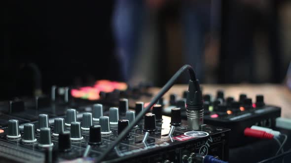 Dj Working at the Event Uses Audio Mixer alt