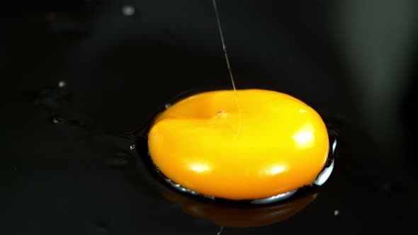 Super Slow Motion Shot of Egg Splash at 1000 Fps. alt