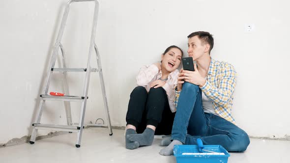 Girlfriend and Boyfriend Discuss Design of New Apartment alt