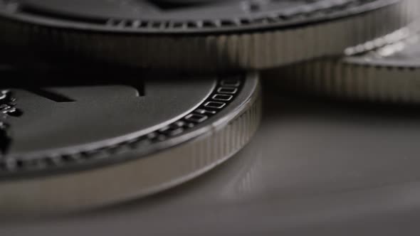Rotating shot of Litecoin Bitcoins (digital cryptocurrency) - BITCOIN LITECOIN 0188 alt