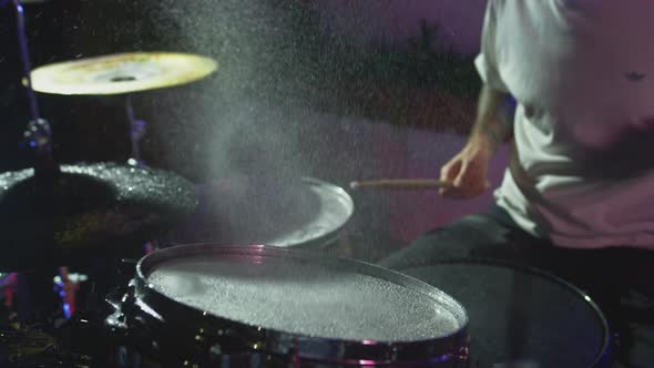 Super Slow Motion Shot of Drum Hit and Splashing Water at 1000 Fps alt