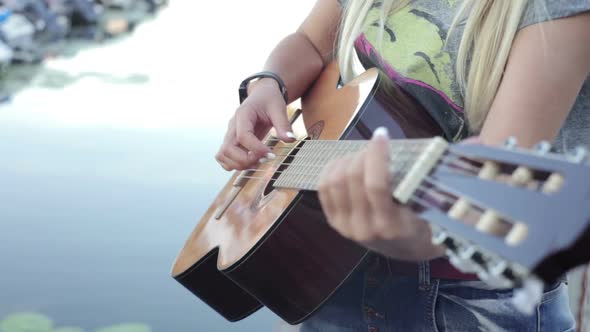 Girl Playing on the Guitar alt