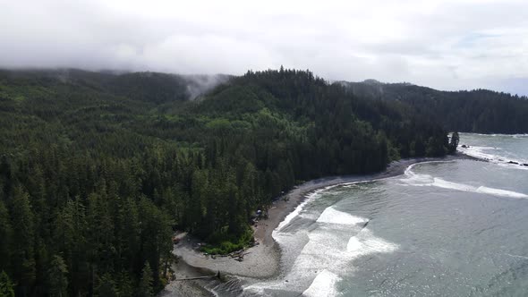 Panning aerial footage above Sombrio beach on the pristine west coast of Vancouver Island, Canada. P alt