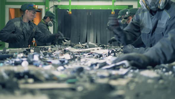 Conveyor Belt with Fragments of Plastic Waste Getting Sorted. Recycling Industry Concept, Plastic alt