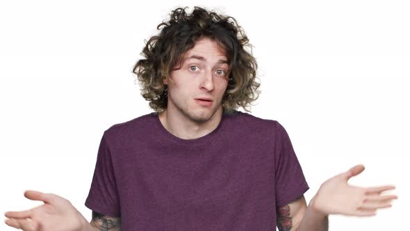 Portrait of Perplexed Guy with Brown Hair Shrugging and Gesturing with ...