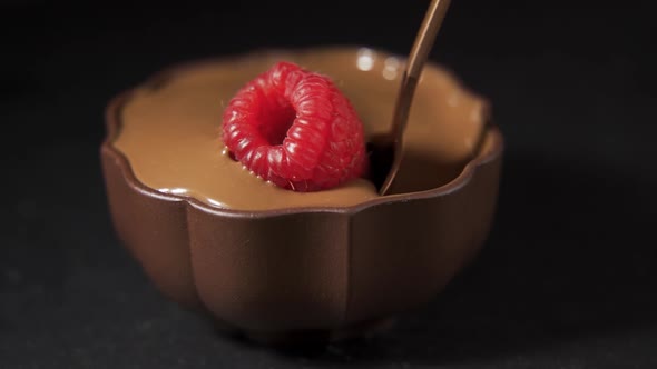 Strawberry in Chocolate Over Swirl Brown Background