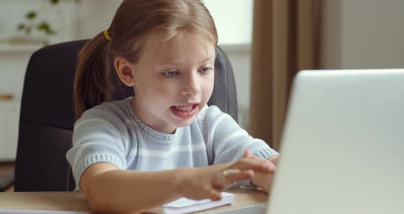 Little Pre Schoolgirl Cute Child Sits at Laptop Typing with Female Fingers on Keyboard, Studying alt