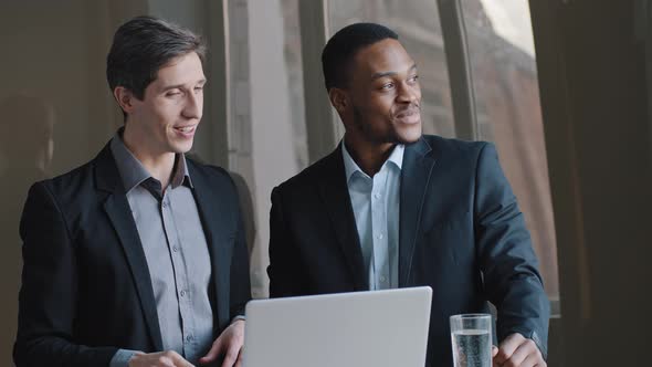 Caucasian Businessman Architect Showing Project on Laptop Online to Client Investor Demonstrating alt