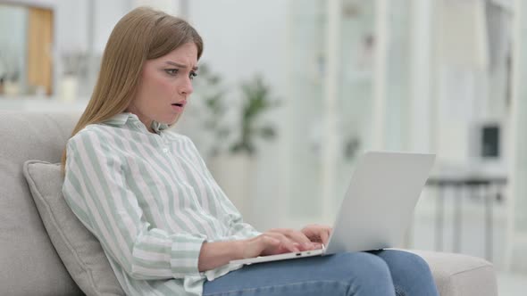 Stressed Young Young Woman Working on Laptop at Home  alt