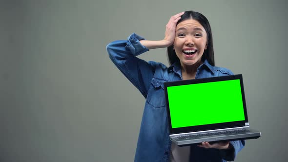 Girl Holding Laptop With Green Screen, Crazy About Discounts, Shopping Online alt