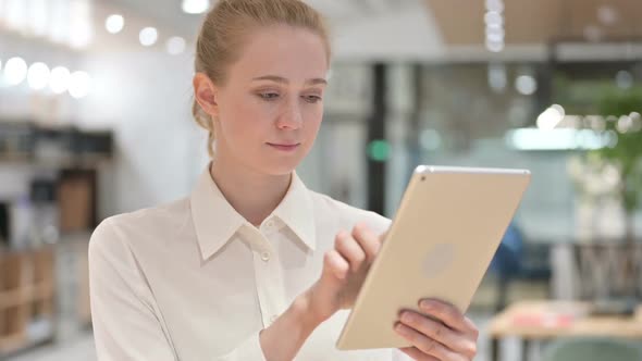 Portrait of Beautiful Young Businesswoman Using Tablet alt
