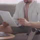 Man with Prosthetic Leg Making Online Payment on Laptop from Home - VideoHive Item for Sale