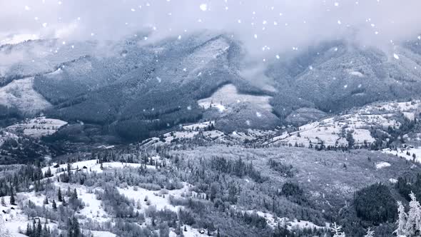 Snowfall in Winter Mountains