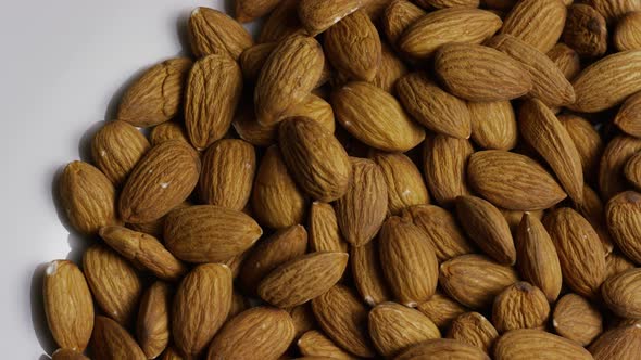 Cinematic, rotating shot of almonds on a white surface - ALMONDS 018 alt