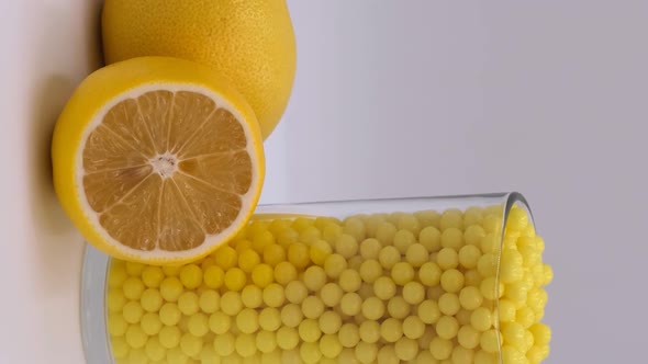 Vertical orientation video: Vitamin C to improve immunity. Ascorbic acid and lemon alt