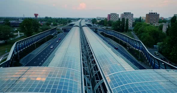 Aerial view on a glass tunnel on a motorway. alt