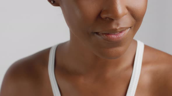 Closeup of Mixed Race Black Woman with Short Haircut Smiling