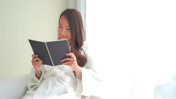 Young asian woman read book