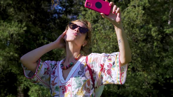 Young Woman Taking a Selfie in the Park