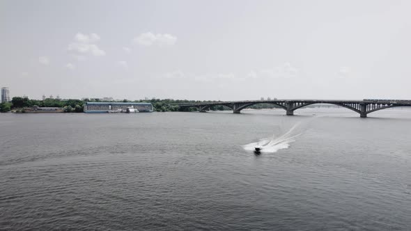 Aerial View on the Boat Drives the River on a High Speed