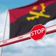 Open Boom Gate Near the Flag of Angola