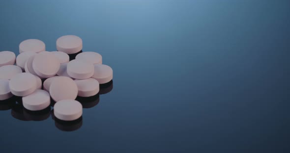 Prescription drugs - Capsules, pills, tablets on reflective background alt