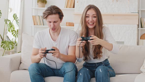 Caucasian Married Couple Millennial Boyfriend and Girlfriend Woman and Man Friends Sitting on Couch alt