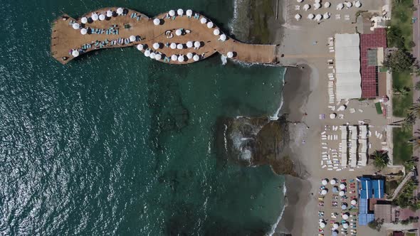 Drone View of Umbrellas on Beach alt