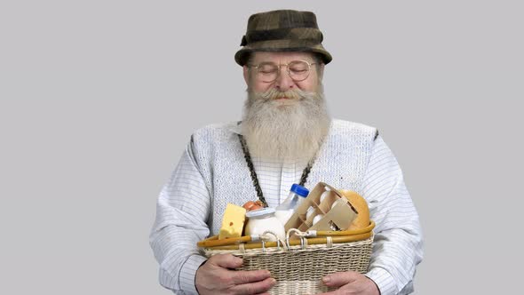 Portrait of Happy Retired Aged Grandpa with Straw Basket of Grocery Food alt