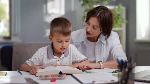 Schoolboy with Teacher at Home