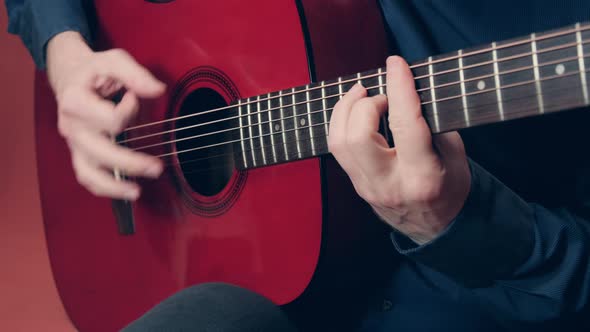 Man Performs Mexican Music on an Acoustic Guitar