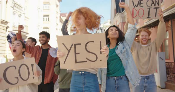 Happy Woman Protester with Poster Yes Shouting Laughing and Rejoicing in Victory alt