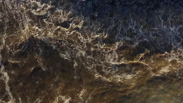 Stunning View of Water Crashing on Stones From Above Force of Nature alt