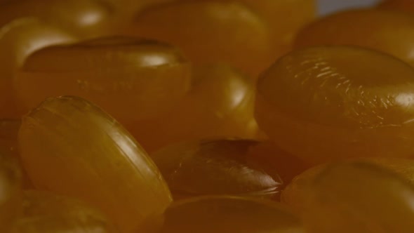 Rotating shot of butterscotch candies - CANDY BUTTERSCOTCH 065 alt
