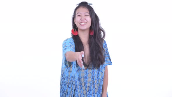 Happy Beautiful Asian Tourist Woman Giving Handshake alt