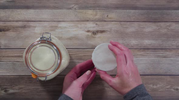 Flat lay. Baking homemade sourdough wheat bread in cast iron dutch oven. alt