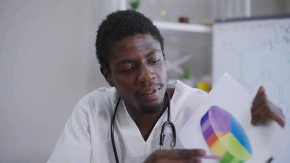 Video Chat with African American Expert Scientist Talking Pointing at Graph Persuading in alt
